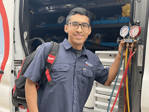 Barbosa tech at his truck - Leave the maintenance stress to our friendly HVAC technicians on your next AC service in Plano, TX.