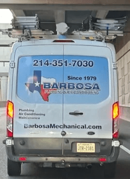 The back of a Barbosa service truck with the company name and phone number advertising the best HVAC services in Richardson.